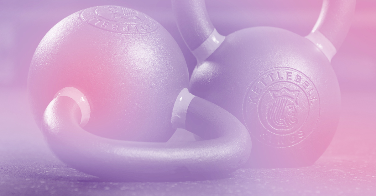 Two kettlebells are pictured beneath a purplish-pink transparent overlay.